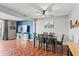 Open dining room with a ceiling fan, stylish decor, and durable wood-look floors at 135 Orchid Dr, Davenport, FL 33897
