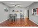 Spacious dining room featuring a modern ceiling fan, neutral walls, and wood-look floors at 135 Orchid Dr, Davenport, FL 33897