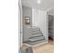 Inviting foyer showcasing stairs, coat closet, and bright, neutral color palette at 135 Orchid Dr, Davenport, FL 33897