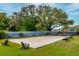 A sand volleyball court with nice seating surrounded by a well maintained lawn at 135 Orchid Dr, Davenport, FL 33897