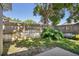 Fenced backyard with green grass and foliage at 143 Abbey Hollow Dr, Apopka, FL 32712