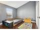 Cozy bedroom with hardwood floors, a window, and a toy chest. Perfect room! at 143 Abbey Hollow Dr, Apopka, FL 32712