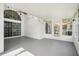 Large sunroom with ceiling fan, bright lighting, and sliding glass doors at 143 Abbey Hollow Dr, Apopka, FL 32712