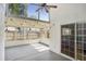 Bright sunroom with ceiling fan and views of the backyard at 143 Abbey Hollow Dr, Apopka, FL 32712