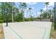 Outdoor community basketball court featuring palm trees and lighting for evening games at 14537 Cheever St, Orlando, FL 32828