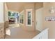 Close-up of the inviting covered front porch with stone columns, offering a welcoming entrance to the home at 14537 Cheever St, Orlando, FL 32828
