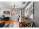 Modern living and dining area with wood floors, ample sunlight, and stylish decor at 14537 Cheever St, Orlando, FL 32828
