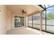 Screened-in patio with ceiling fan, perfect for enjoying the outdoors at 14537 Cheever St, Orlando, FL 32828