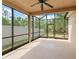 Relaxing screened patio with ceiling fan overlooking fenced backyard at 14537 Cheever St, Orlando, FL 32828