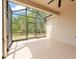 Serene screened patio with ceiling fan offering backyard views at 14537 Cheever St, Orlando, FL 32828