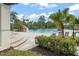 Community swimming pool with a waterfall feature, lounge chairs, and tropical landscaping at 14537 Cheever St, Orlando, FL 32828