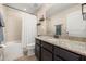 Bright bathroom with a granite countertop, a shower over tub and tile flooring at 14742 Bahama Swallow Blvd, Winter Garden, FL 34787