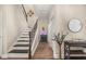 Inviting foyer with hardwood floors, staircase, decor table and decor at 14742 Bahama Swallow Blvd, Winter Garden, FL 34787
