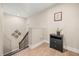 Upstairs hallway with hardwood floors and an elegant staircase, leading to the home's upper level at 14742 Bahama Swallow Blvd, Winter Garden, FL 34787
