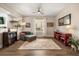 Comfortable living room with hardwood floors, neutral colors, and plenty of natural light at 14742 Bahama Swallow Blvd, Winter Garden, FL 34787