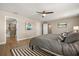 Large main bedroom showcases hardwood floors, neutral paint, and ensuite bathroom at 14742 Bahama Swallow Blvd, Winter Garden, FL 34787