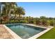 Inviting in-ground pool featuring a modern tile surround, lush landscaping, and comfortable seating at 14742 Bahama Swallow Blvd, Winter Garden, FL 34787