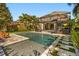 Inviting screened-in pool with lush landscaping and outdoor kitchen perfect for relaxing and entertaining at 14742 Bahama Swallow Blvd, Winter Garden, FL 34787