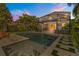 Inviting in-ground pool featuring a modern tile surround and covered outdoor patio with grill at 14742 Bahama Swallow Blvd, Winter Garden, FL 34787