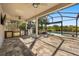 Fully equipped outdoor kitchen, comfortable wicker seating area, with screened lanai overlooking a sparkling pool at 14742 Bahama Swallow Blvd, Winter Garden, FL 34787