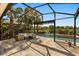 Spacious screened patio overlooking the pool and lush backyard, complete with comfortable seating for outdoor living at 14742 Bahama Swallow Blvd, Winter Garden, FL 34787
