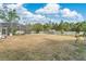 Large fenced-in backyard featuring a screened-in pool and ample space for outdoor activities at 1512 Adriatic Dr, Ocoee, FL 34761