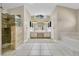 Elegant bathroom with dual sinks, separate shower, soaking tub, and bright natural lighting at 1512 Adriatic Dr, Ocoee, FL 34761