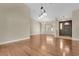 Spacious foyer and dining area with sleek hardwood floors, neutral walls, and a decorative light fixture at 1512 Adriatic Dr, Ocoee, FL 34761