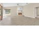 Open living area with fireplace, large window, and sliding glass door offer plenty of natural light at 1512 Adriatic Dr, Ocoee, FL 34761