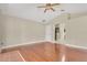 Bright living room featuring wood floors, ceiling fan, and neutral paint, ready for your personal touch at 1512 Adriatic Dr, Ocoee, FL 34761