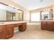 Bathroom featuring double vanity, a tub, and tiled floors at 173 Donner Dr, Winter Garden, FL 34787