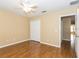 Neutral bedroom featuring a large closet and hardwood floors at 173 Donner Dr, Winter Garden, FL 34787