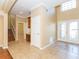 Bright foyer with tile flooring, high ceilings, and double doors leading to the outside at 173 Donner Dr, Winter Garden, FL 34787