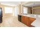 Eat-in kitchen with tile flooring, lots of natural light, and ample counter space at 173 Donner Dr, Winter Garden, FL 34787