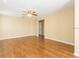 Large living room featuring wood floors and a ceiling fan at 173 Donner Dr, Winter Garden, FL 34787