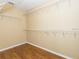 Walk-in closet featuring multiple shelves and hardwood floors at 173 Donner Dr, Winter Garden, FL 34787