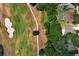 Aerial view of property located on golf course; includes manicured yard, nearby pool, and mature trees at 1937 Crystal Downs Ct, Oviedo, FL 32765