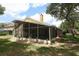 View of the rear of the home with a large lanai, offering a perfect blend of indoor and outdoor living at 1937 Crystal Downs Ct, Oviedo, FL 32765