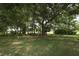 Large, lush backyard with mature trees provides a private and serene outdoor space at 1937 Crystal Downs Ct, Oviedo, FL 32765