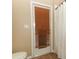 Bathroom door leading outside with brown blinds providing privacy and light control at 1937 Crystal Downs Ct, Oviedo, FL 32765