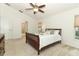 Bright bedroom with a ceiling fan, neutral carpet, and a door that leads into the bathroom at 1937 Crystal Downs Ct, Oviedo, FL 32765