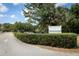 Twin Rivers Golf Club community entrance with a sign that reads 