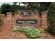 Twin Rivers community sign welcomes you into the neighborhood with lush landscaping and brick aesthetics at 1937 Crystal Downs Ct, Oviedo, FL 32765