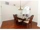 Dining room showcases hardwood flooring, decorative wainscoting and natural lighting at 1937 Crystal Downs Ct, Oviedo, FL 32765