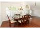 Dining area with a table set for six, hardwood floors, and natural light at 1937 Crystal Downs Ct, Oviedo, FL 32765