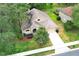 Aerial view of a well-maintained single-Gathering home with a lush green lawn and a long driveway at 1937 Crystal Downs Ct, Oviedo, FL 32765