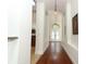 Bright foyer boasts hardwood floors, high ceilings, and arched windows above the double front doors at 1937 Crystal Downs Ct, Oviedo, FL 32765