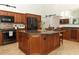 Updated kitchen featuring granite countertops, stainless steel appliances, and a large kitchen island at 1937 Crystal Downs Ct, Oviedo, FL 32765