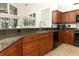 Kitchen features granite counters, stainless appliances, and lots of storage in the wood cabinets at 1937 Crystal Downs Ct, Oviedo, FL 32765