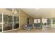 Covered lanai boasts tile flooring, ceiling fans, and ample room for relaxation and entertainment at 1937 Crystal Downs Ct, Oviedo, FL 32765